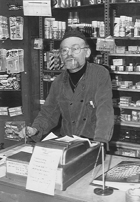 Ed Pols behind the shop counter in the "van der Hoopstraat"